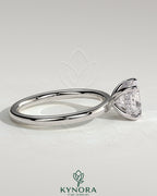 Kynora CJ 2ct cushion cut solitaire engagement ring with hidden halo featuring a sparkling diamond and elegant band.