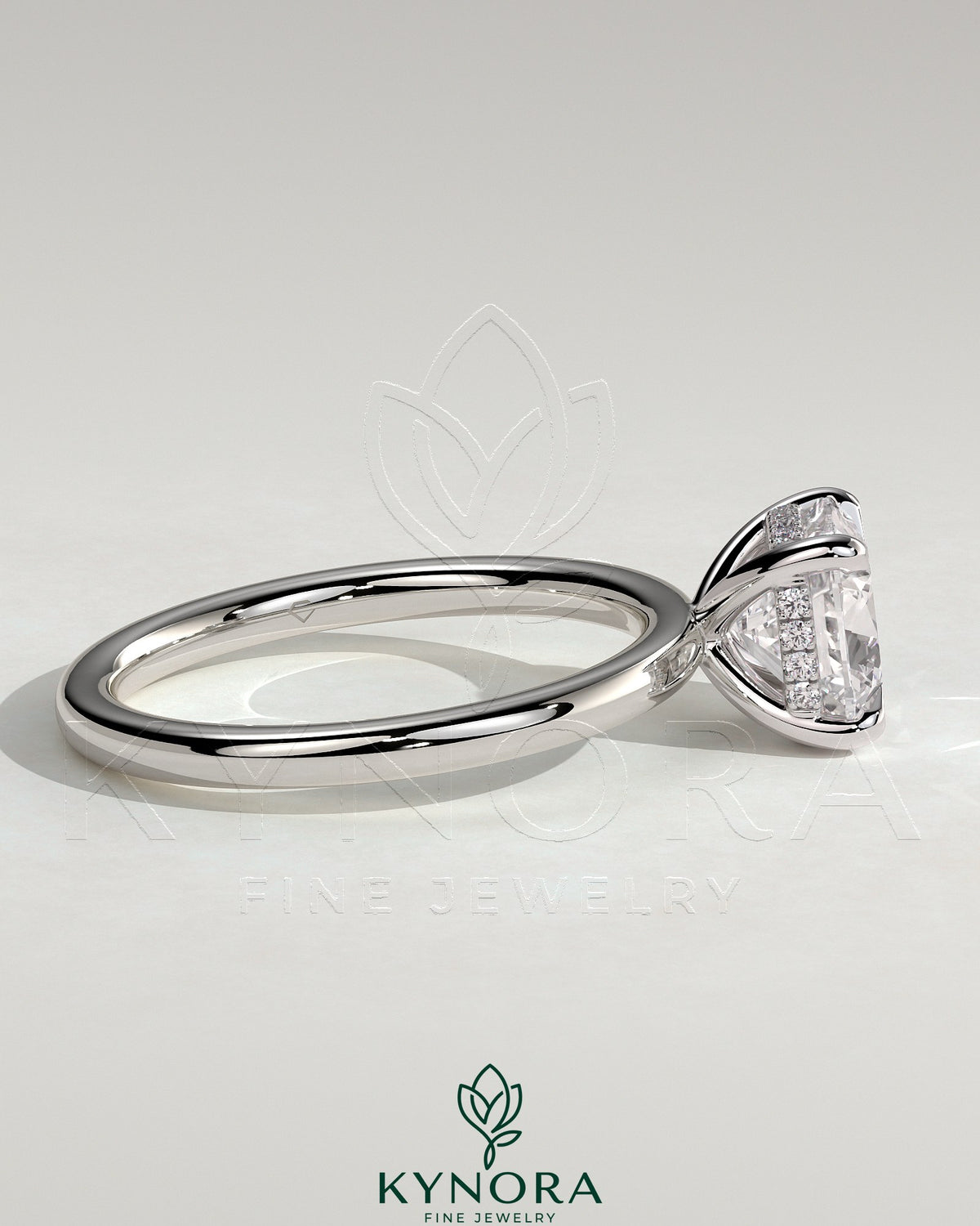 Kynora CJ 2ct cushion cut solitaire engagement ring with hidden halo featuring a sparkling diamond and elegant band.