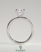Kynora CJ 2-carat cushion claw solitaire engagement ring with hidden halo, featuring a sparkling central diamond and elegant design.