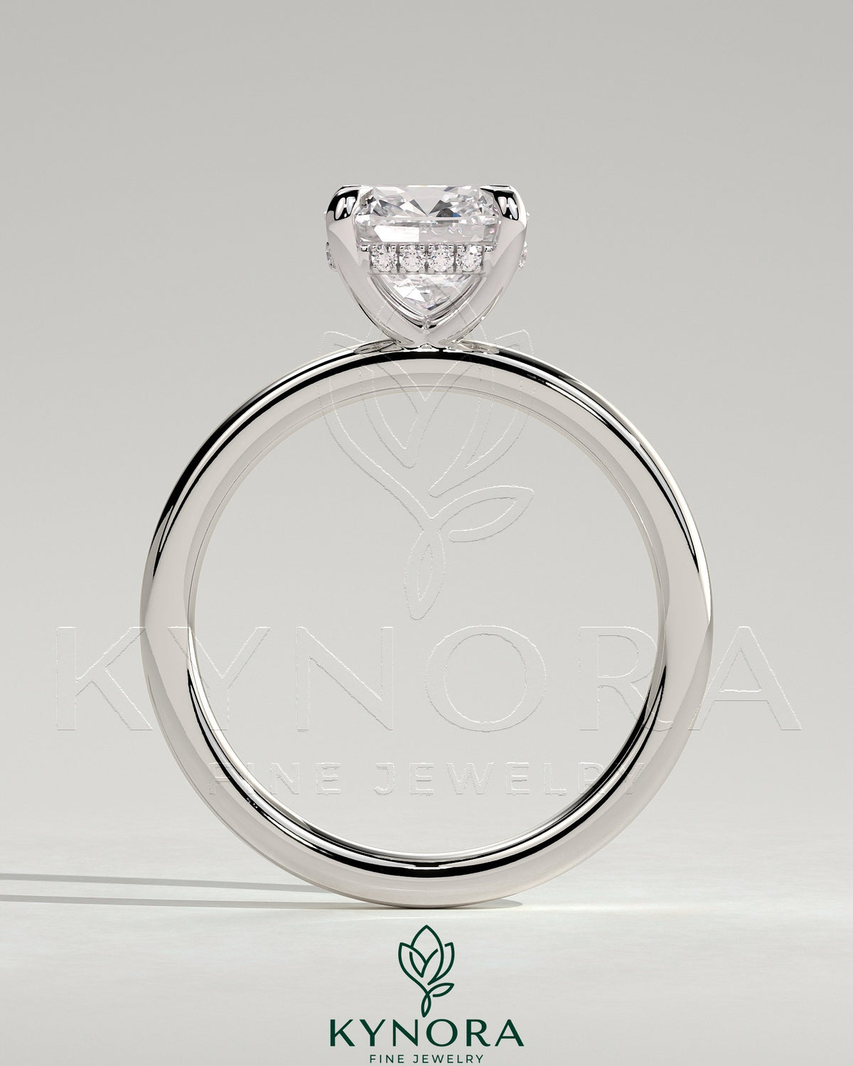 Kynora CJ 2-carat cushion claw solitaire engagement ring with hidden halo, featuring a sparkling central diamond and elegant design.