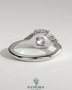 Kynora CJ 2ct cushion claw solitaire engagement ring with round shoulder accent stones, elegant and sparkling jewelry piece.