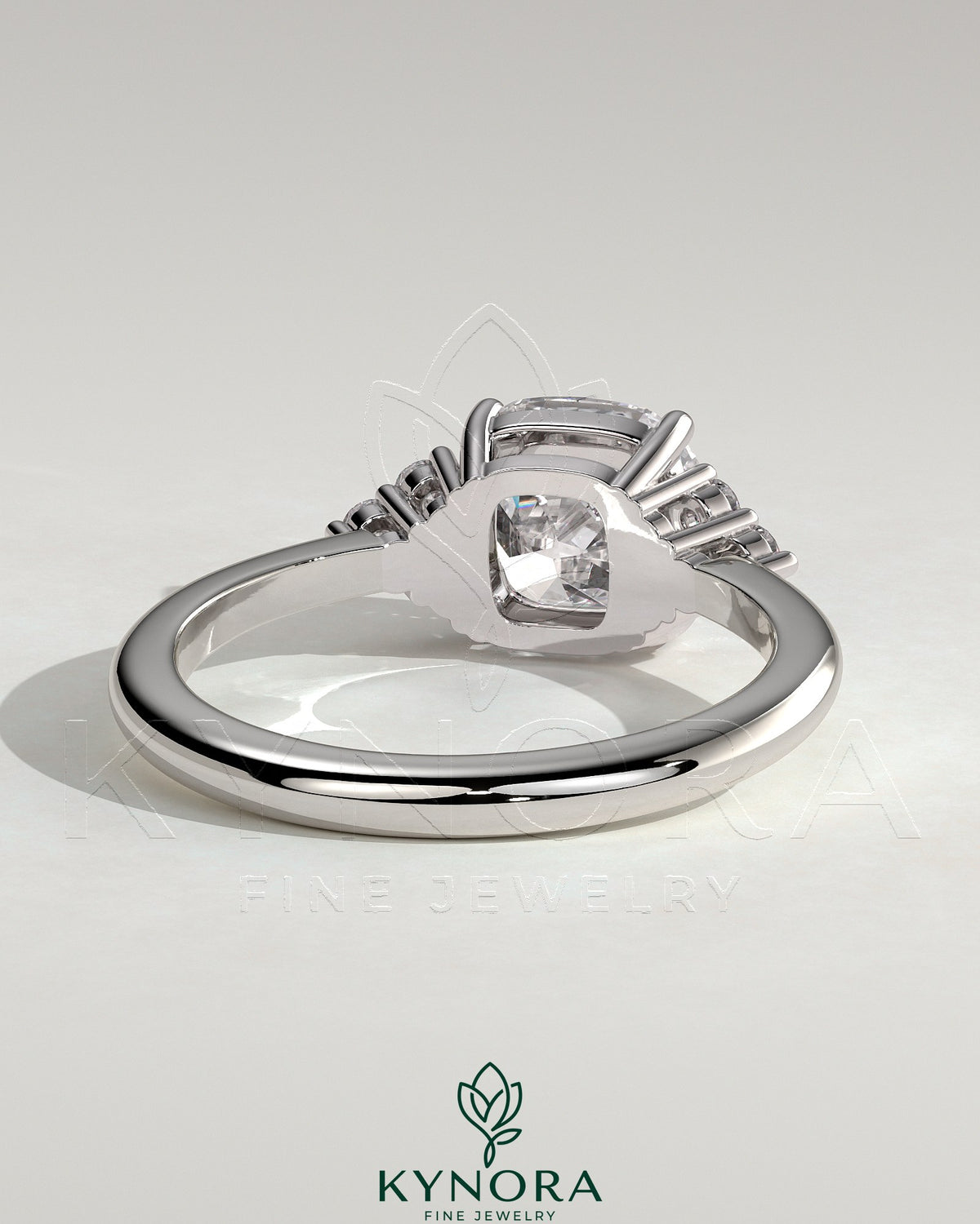 Kynora CJ 2ct cushion claw solitaire engagement ring with round shoulder accent stones, elegant and sparkling jewelry piece.