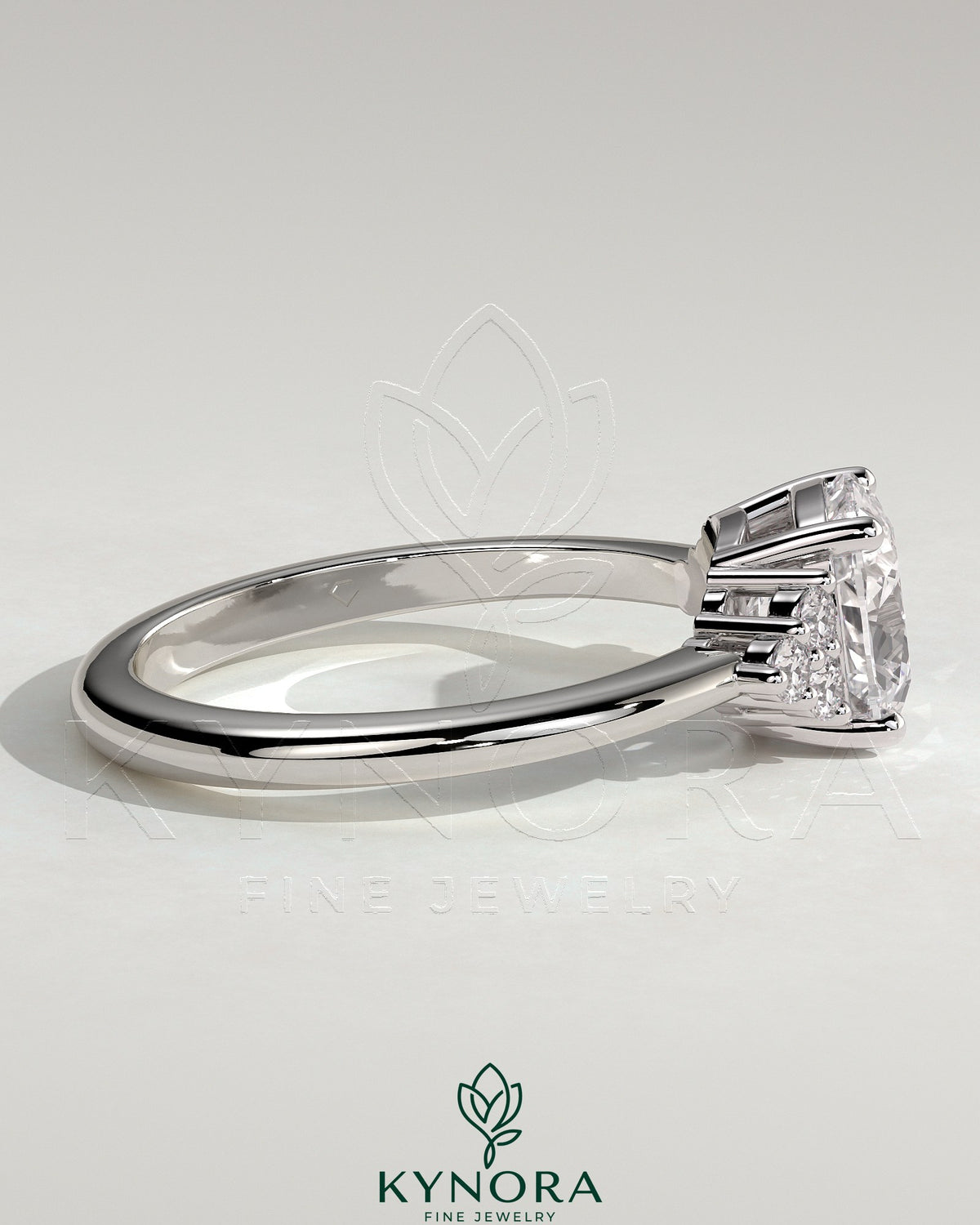 Kynora CJ 2ct cushion claw solitaire engagement ring with round shoulder stones, featuring a sparkling center stone and intricate band design.