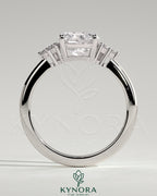Kynora CJ 2ct cushion claw solitaire engagement ring with round shoulder stones, showcasing elegant diamond setting and craftsmanship.