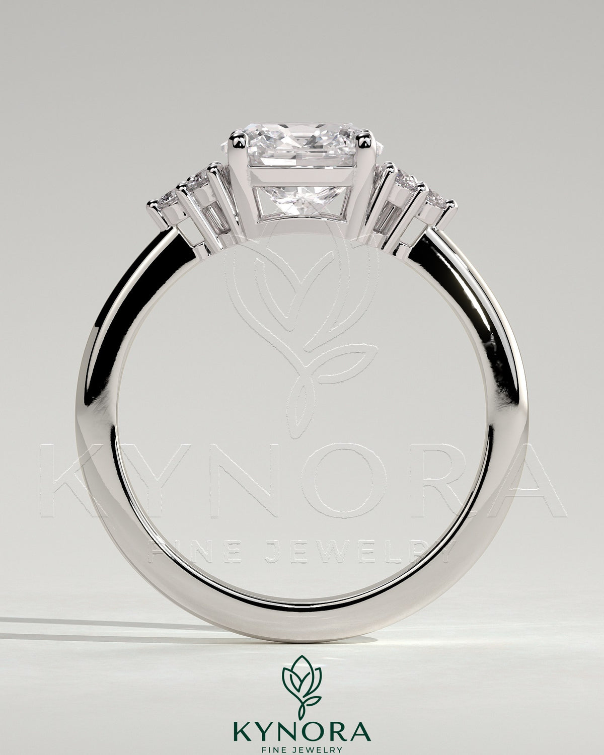 Kynora CJ 2ct cushion claw solitaire engagement ring with round shoulder stones, showcasing elegant diamond setting and craftsmanship.