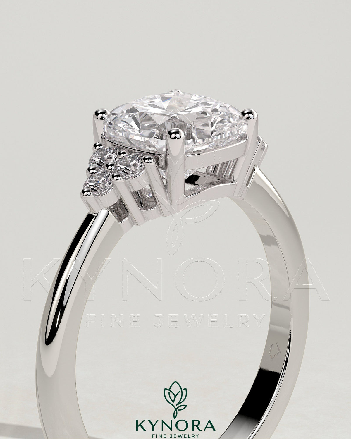 Kynora CJ 2-carat cushion claw solitaire engagement ring with round shoulder accent stones, elegant and sparkling jewelry.