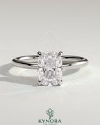 Kynora CJ 2ct elongated cushion cut diamond solitaire engagement ring with a sleek gold band and classic design.