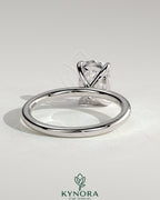 Kynora CJ 2ct elongated cushion cut diamond solitaire engagement ring with a sleek band and elegant setting.