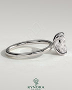 Kynora CJ 2ct elongated cushion cut diamond solitaire engagement ring with a sleek band and elegant design.
