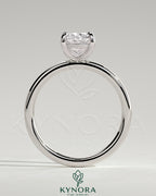 Kynora CJ 2ct elongated cushion cut solitaire engagement ring with a sleek band and sparkling center stone.