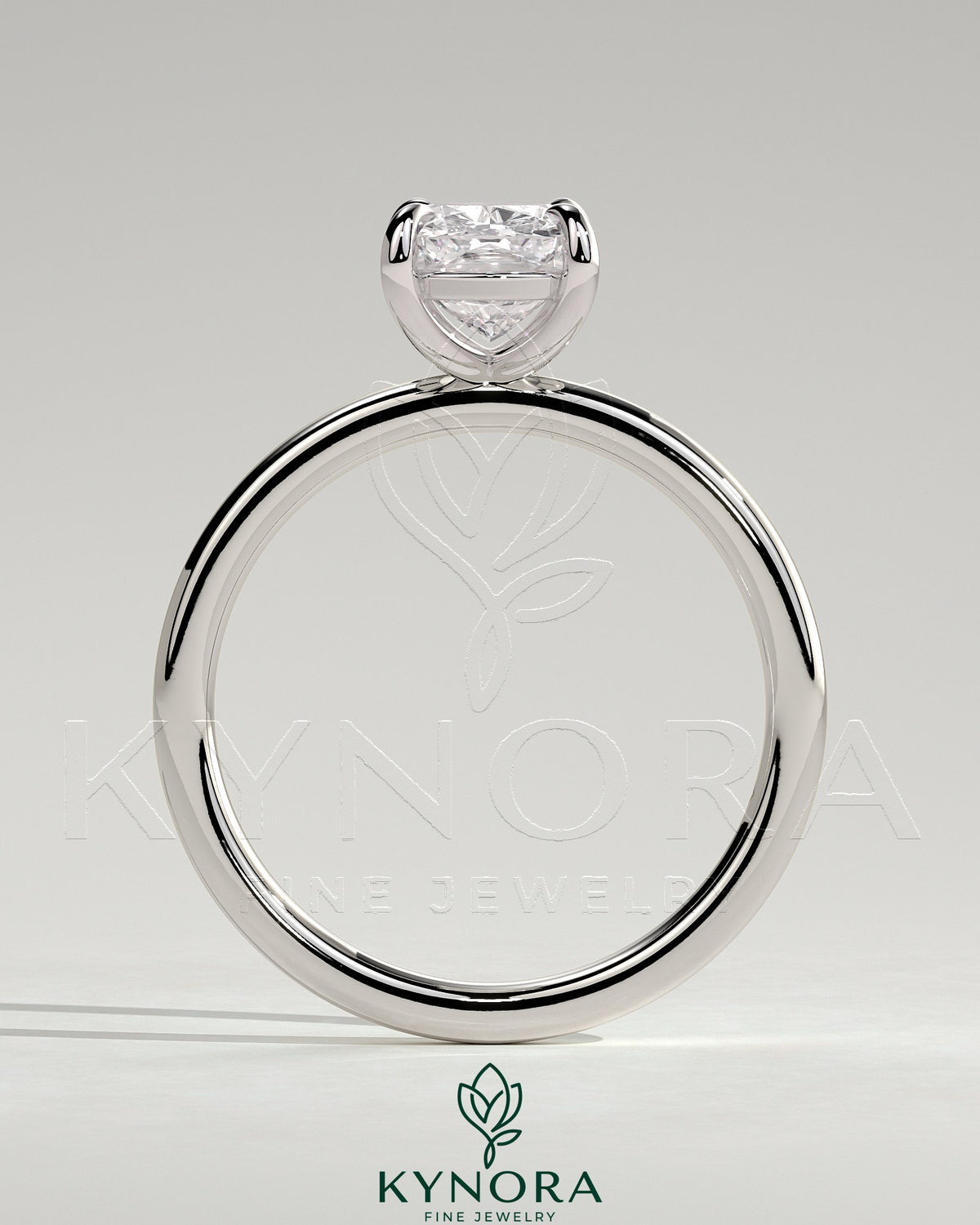 Kynora CJ 2ct elongated cushion cut solitaire engagement ring with a sleek band and sparkling center stone.