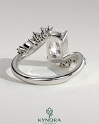Kynora CJ 2ct elongated cushion claw solitaire engagement ring with bypass band and clustered round-marquise accent stones