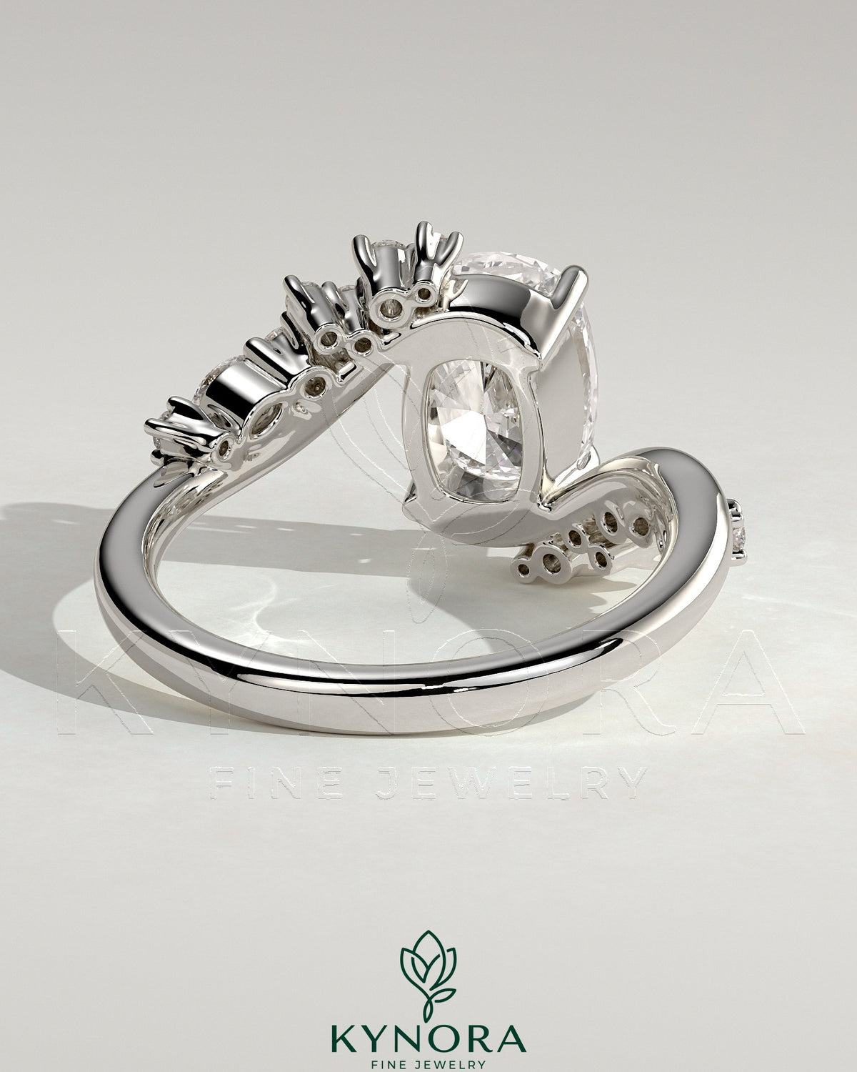 Kynora CJ 2ct elongated cushion claw solitaire engagement ring with bypass band and clustered round-marquise accent stones