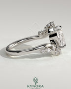 Kynora CJ 2ct elongated cushion claw solitaire engagement ring with bypass band and clustered round-marquise accent stones