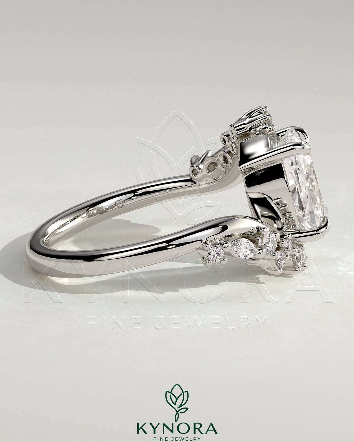 Kynora CJ 2ct elongated cushion claw solitaire engagement ring with bypass band and clustered round-marquise accent stones