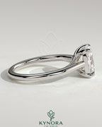 Kynora CJ 2ct elongated cushion cut solitaire engagement ring with cathedral low setting and open trellis gallery design.