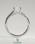 Kynora CJ 2ct elongated cushion cut solitaire engagement ring with cathedral low setting and open trellis gallery design.