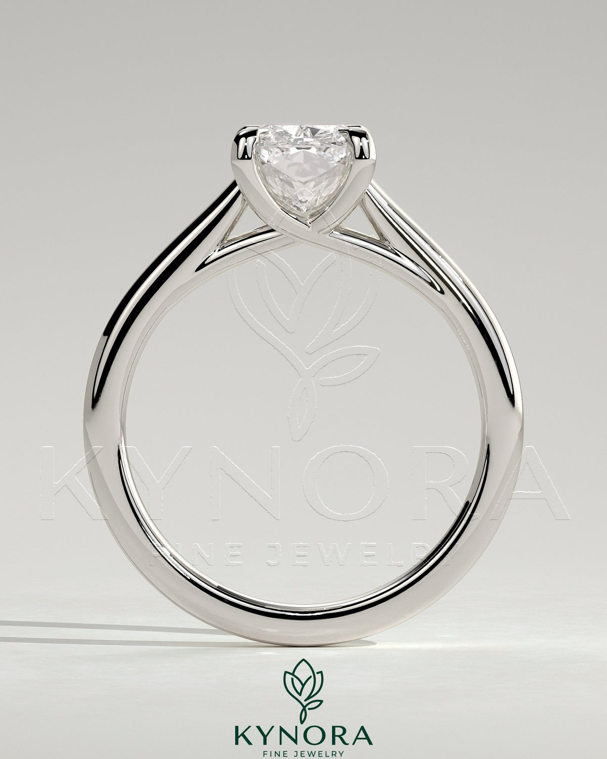 Kynora CJ 2ct elongated cushion cut solitaire engagement ring with cathedral low setting and open trellis gallery design.