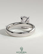 Kynora CJ 2ct elongated cushion solitaire engagement ring with cigar band and hidden halo, featuring a sparkling central diamond.