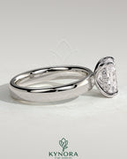 Kynora CJ 2ct elongated cushion solitaire engagement ring with cigar band and hidden halo design, featuring a sparkling diamond.