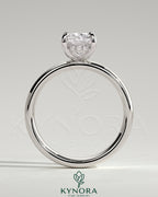 Kynora CJ 2ct elongated cushion cut solitaire engagement ring with cigar band and hidden halo, showcasing detailed craftsmanship.