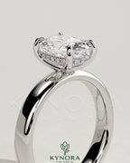 Kynora CJ 2ct elongated cushion cut solitaire engagement ring with cigar band and hidden halo setting, crafted in sterling silver.