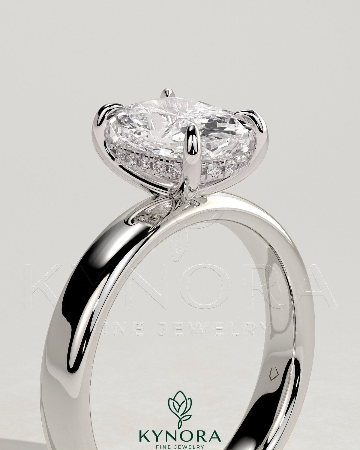 Kynora CJ 2ct elongated cushion cut solitaire engagement ring with cigar band and hidden halo setting, crafted in sterling silver.