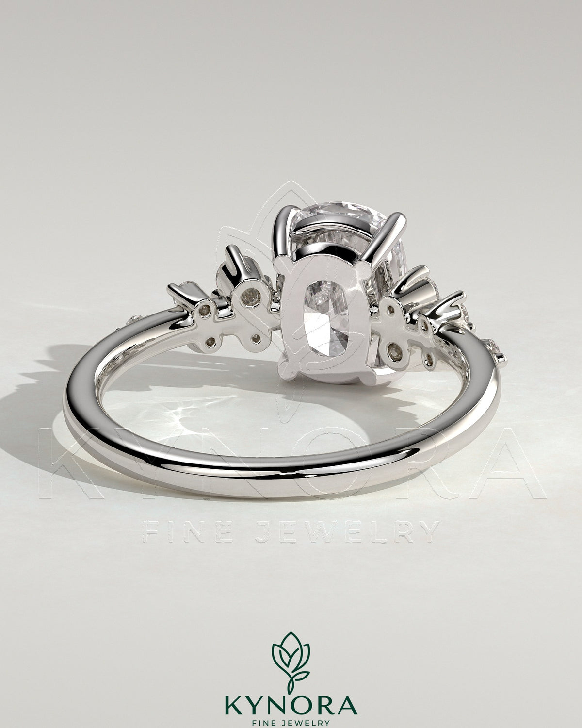 Kynora CJ 2ct elongated cushion claw solitaire engagement ring with cluster round shoulder stones, elegant and sparkling jewelry piece