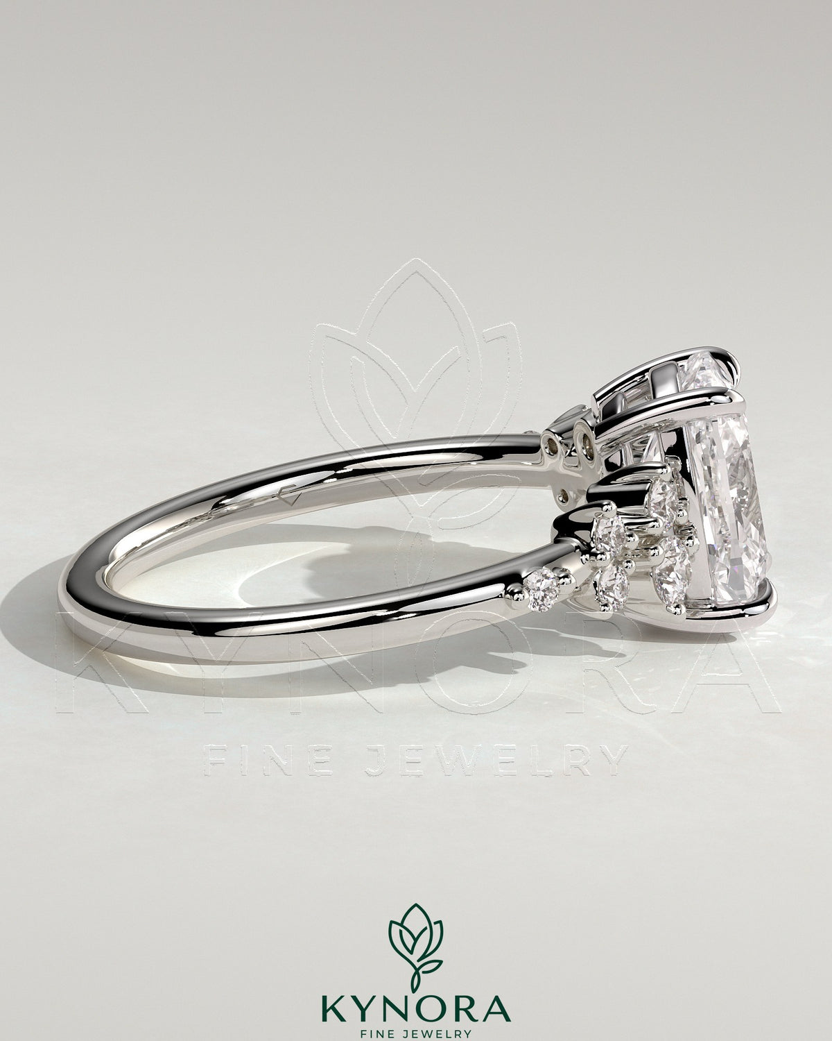 Kynora CJ 2ct elongated cushion claw solitaire engagement ring with clustered round shoulder stones and intricate band design.