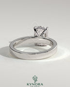 Kynora CJ 2ct elongated cushion cut solitaire engagement ring with flat cigar band and hidden halo design.