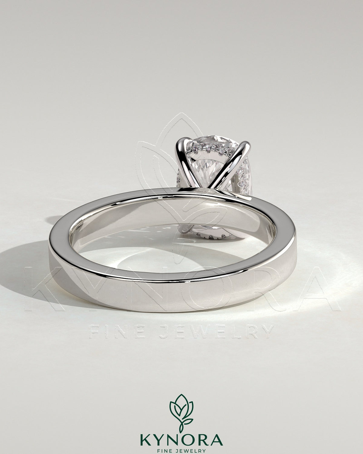 Kynora CJ 2ct elongated cushion cut solitaire engagement ring with flat cigar band and hidden halo design.