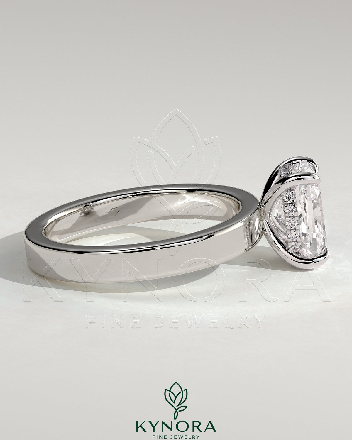 Kynora CJ 2ct elongated cushion cut solitaire engagement ring with flat cigar band and hidden halo design.