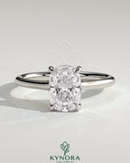 Kynora CJ 2ct elongated cushion cut solitaire engagement ring with hidden halo and cathedral high setting, showcasing intricate design.
