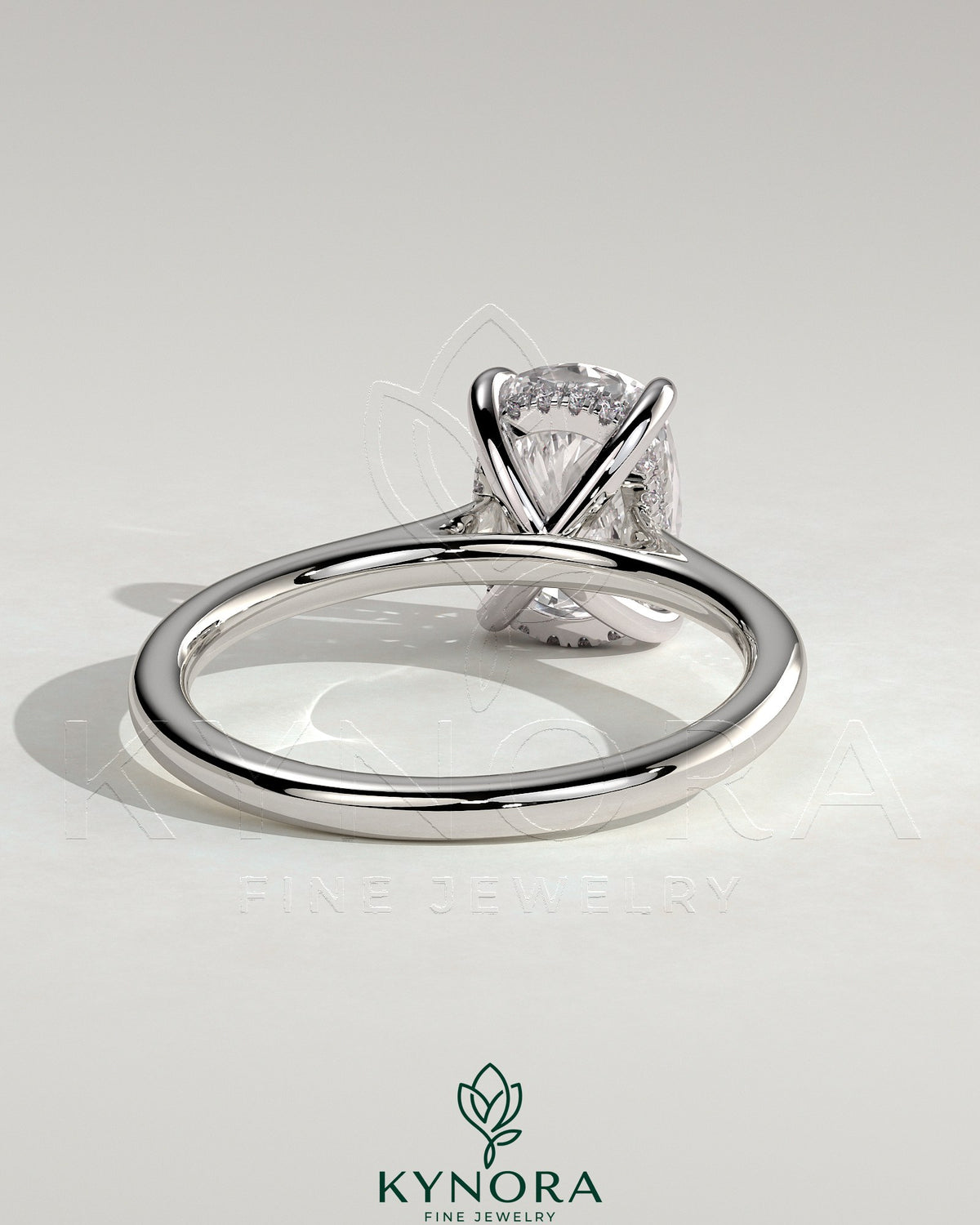 Kynora CJ 2ct elongated cushion solitaire engagement ring with hidden halo and cathedral high setting, showcasing intricate design.