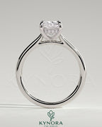 Kynora CJ 2ct elongated cushion cut solitaire engagement ring with hidden halo and cathedral high setting, showcasing intricate design.