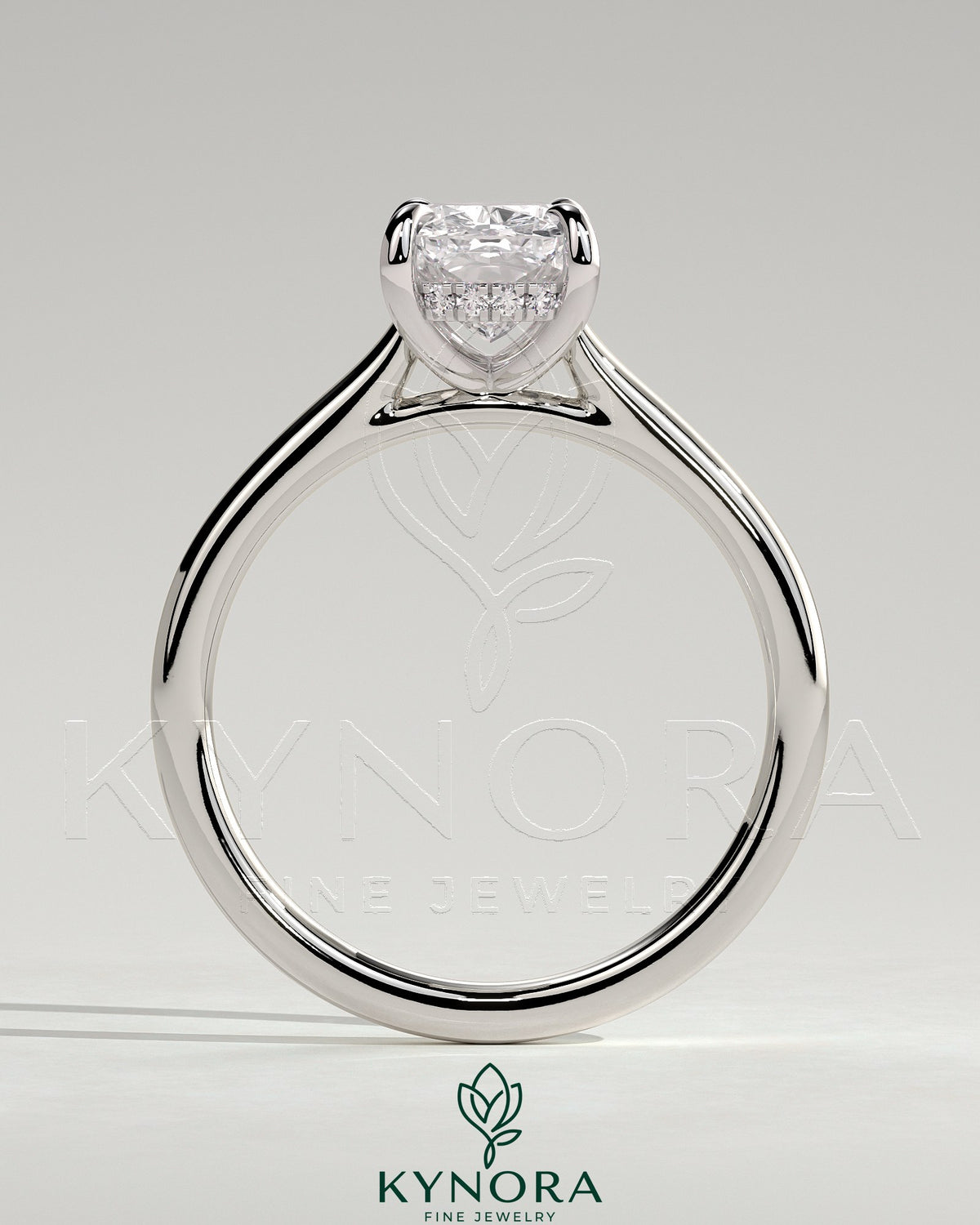 Kynora CJ 2ct elongated cushion cut solitaire engagement ring with hidden halo and cathedral high setting, showcasing intricate design.