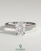 Kynora CJ 2-carat elongated cushion claw solitaire engagement ring with hidden halo and pave band, showcasing sparkling diamond details.