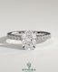 Kynora CJ 2-carat elongated cushion claw solitaire engagement ring with hidden halo and pave band, showcasing sparkling diamond details.