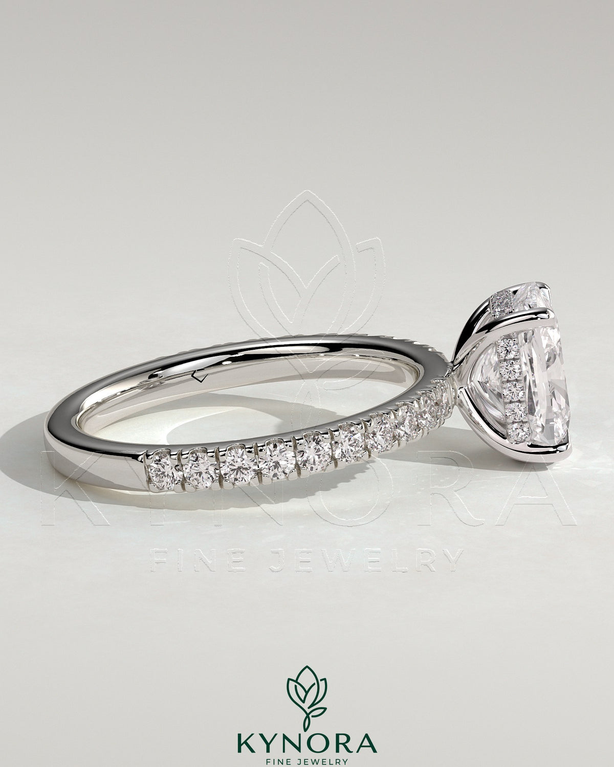 Kynora CJ 2ct elongated cushion claw solitaire engagement ring with hidden halo and pave band, showcasing fine diamond craftsmanship.