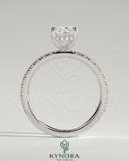 Kynora CJ 2ct elongated cushion solitaire engagement ring with hidden halo and pave band in white gold.