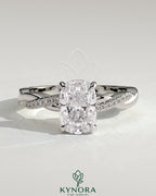 Kynora CJ 2ct elongated cushion cut solitaire engagement ring with hidden halo and twisted pave band, showcasing craftsmanship.