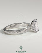 Kynora CJ 2ct elongated cushion cut solitaire engagement ring with hidden halo and twisted pave band, gold or platinum setting.