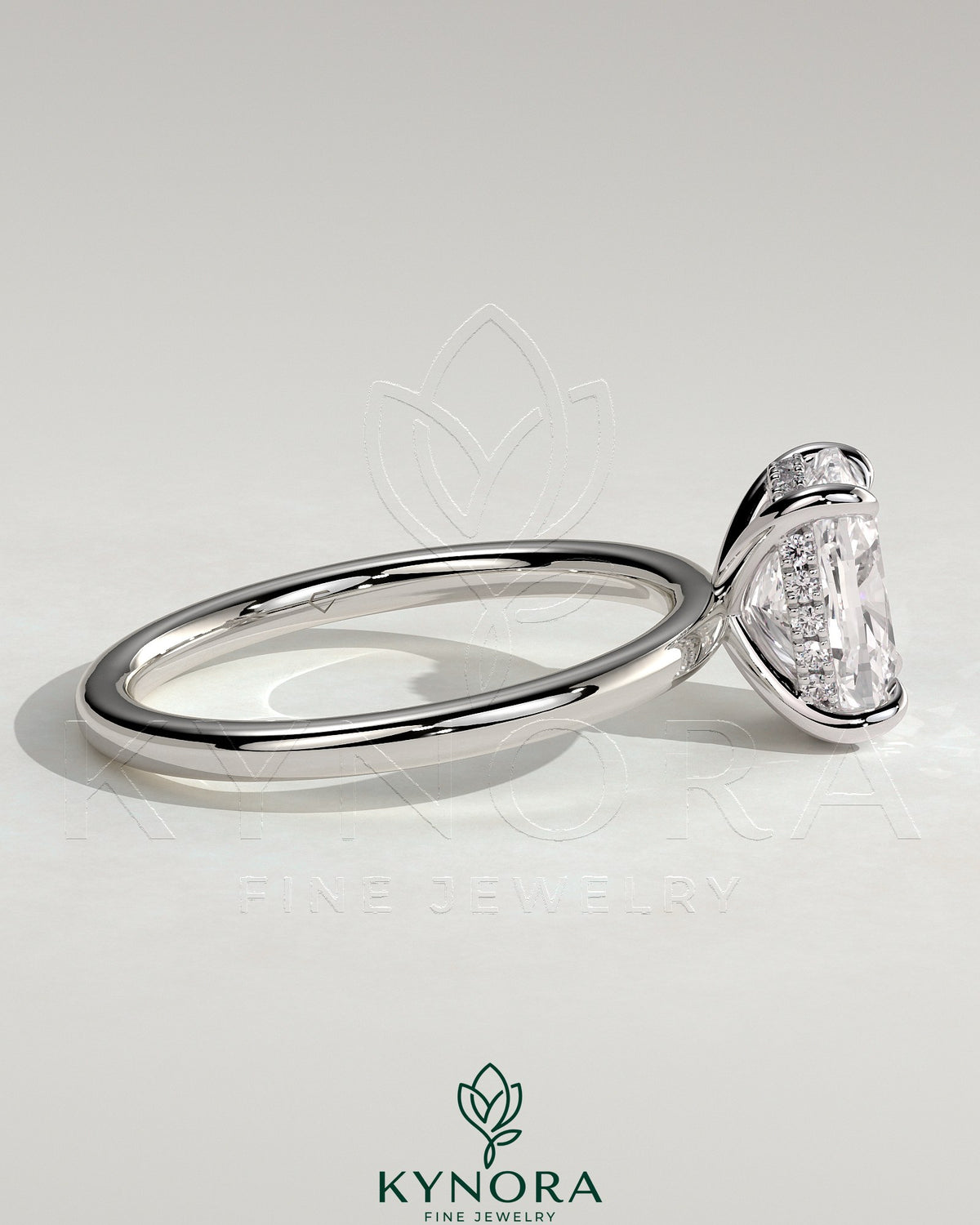 Kynora CJ 2ct elongated cushion cut solitaire engagement ring with hidden halo, featuring a sleek gold band and sparkling center stone.