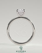 Kynora CJ 2ct elongated cushion claw solitaire engagement ring with hidden halo in platinum, detailed close-up image.