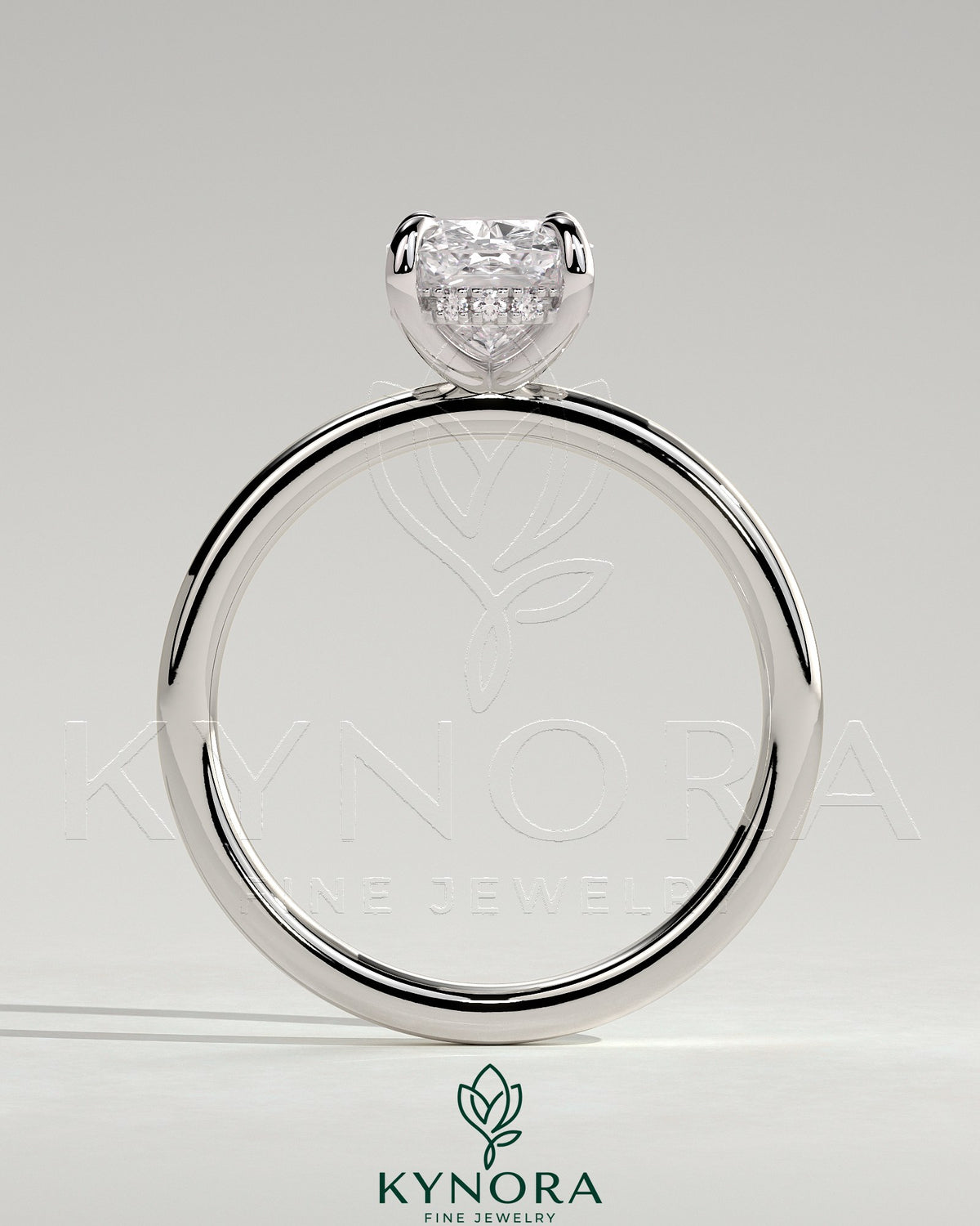 Kynora CJ 2ct elongated cushion claw solitaire engagement ring with hidden halo in platinum, detailed close-up image.
