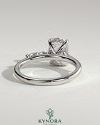 Kynora CJ 2ct elongated cushion solitaire engagement ring with hidden halo, marquise accents, and cathedral high setting.