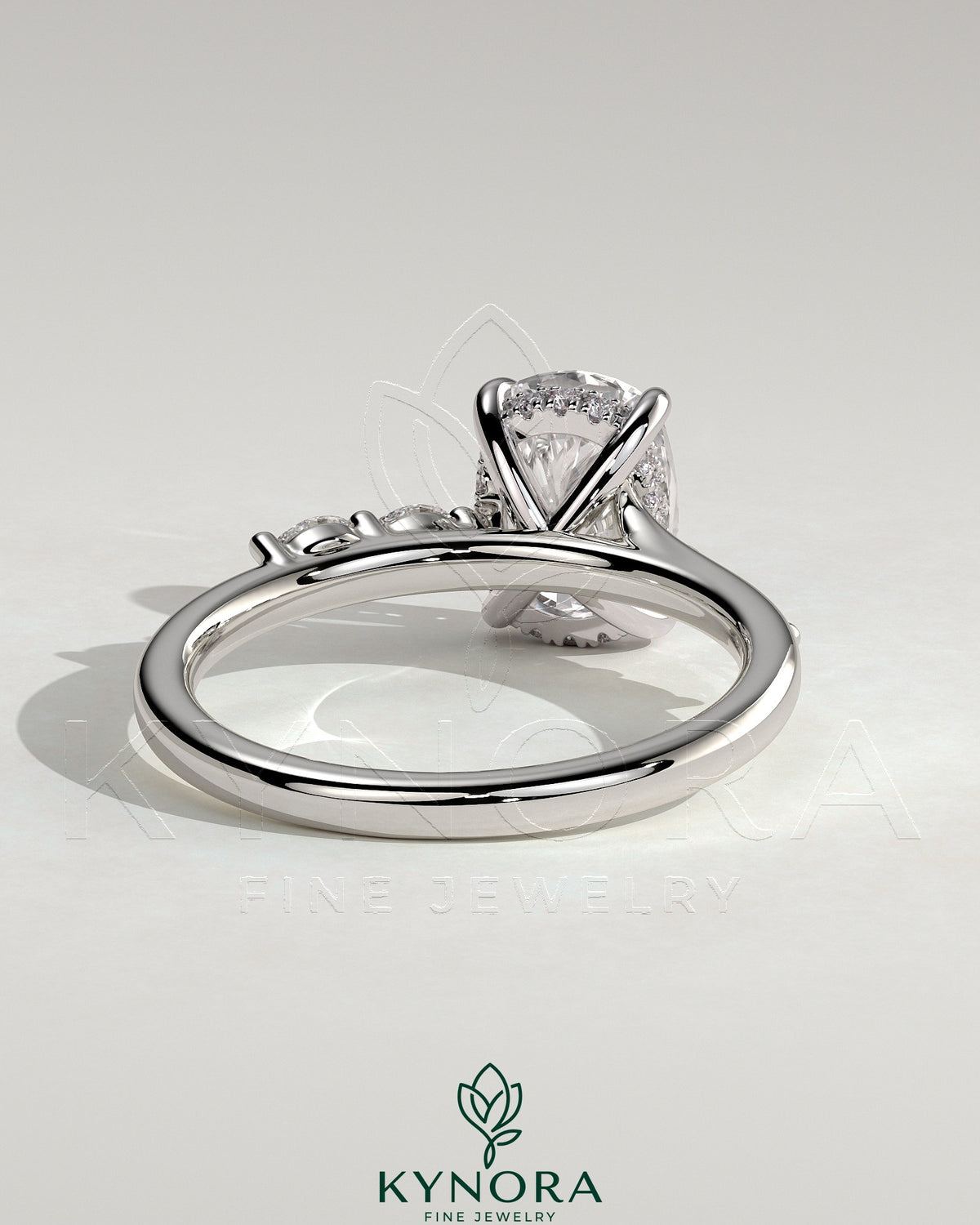 Kynora CJ 2ct elongated cushion solitaire engagement ring with hidden halo, marquise accents, and cathedral high setting.