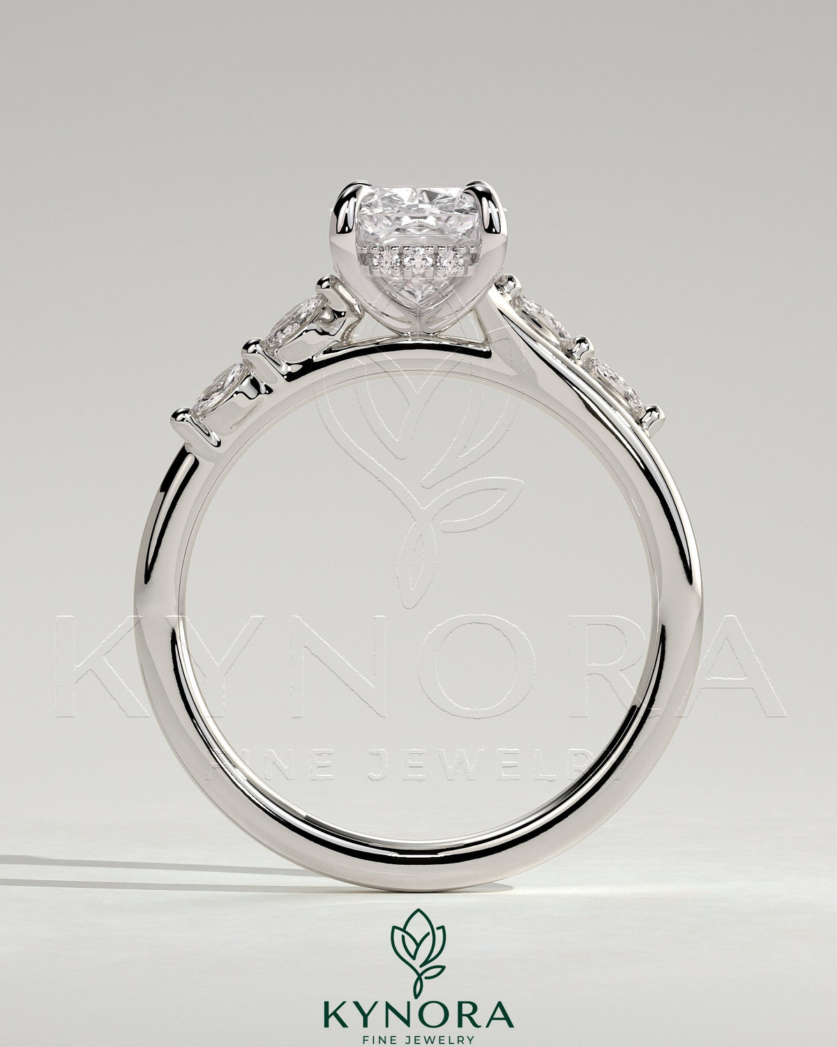 Kynora CJ 2ct elongated cushion solitaire engagement ring with hidden halo, marquise accents, and cathedral high setting.