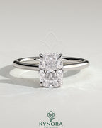 Kynora CJ 2ct elongated cushion solitaire engagement ring with hidden halo, tapered band, cathedral high setting.