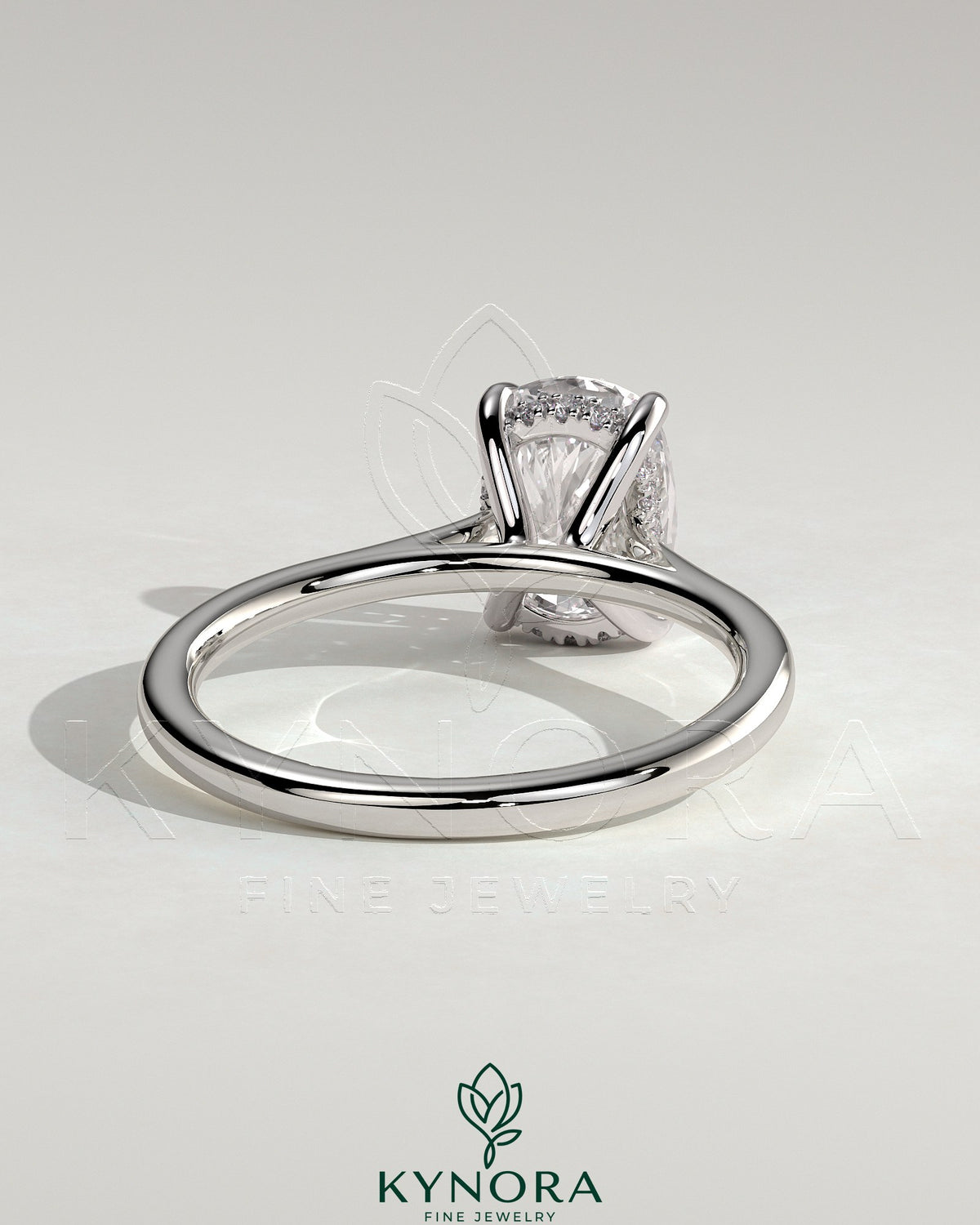 Kynora CJ 2ct elongated cushion diamond solitaire engagement ring with hidden halo, tapered band, and cathedral high setting.